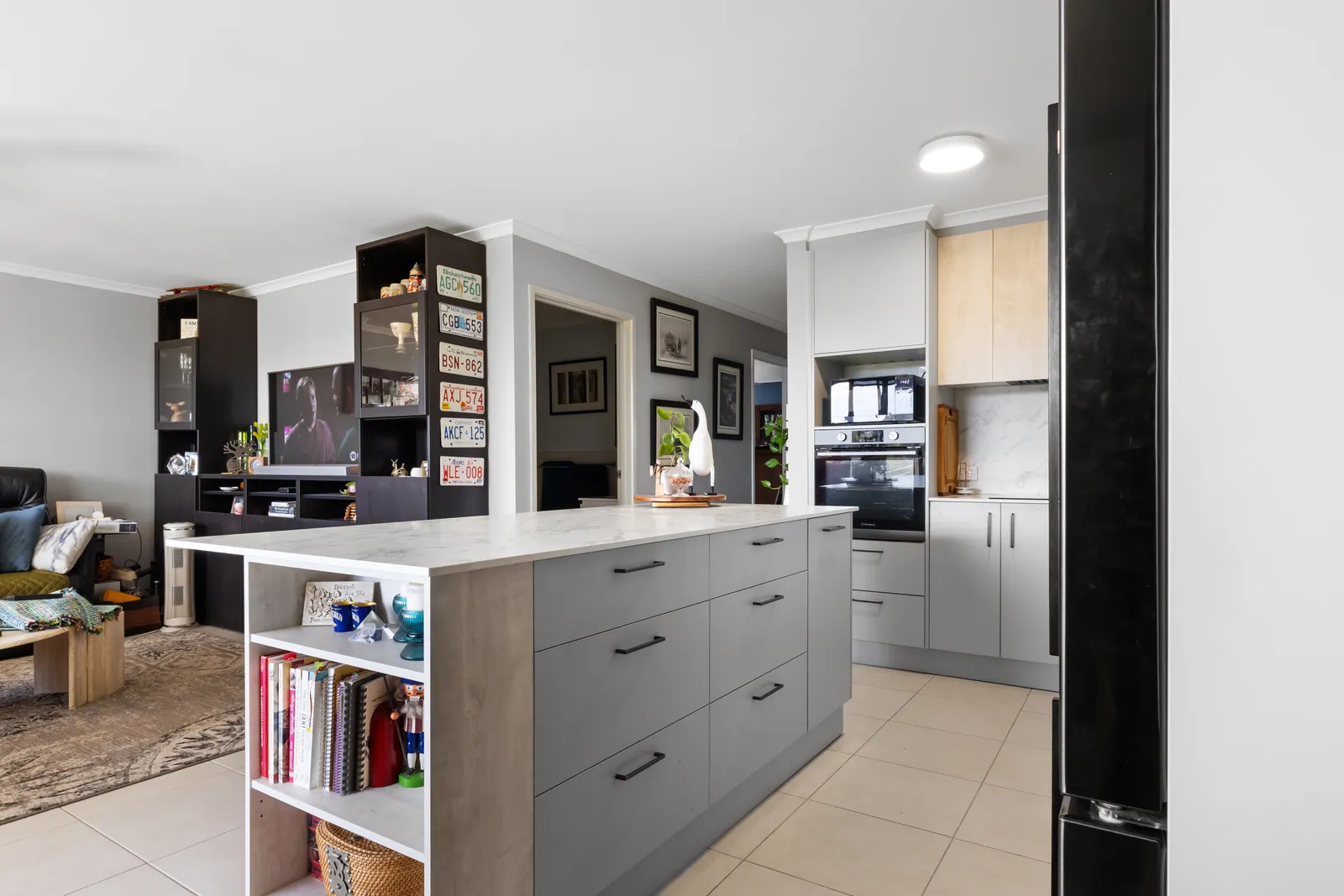 Open shelving on the end of the Bruce kitchen island