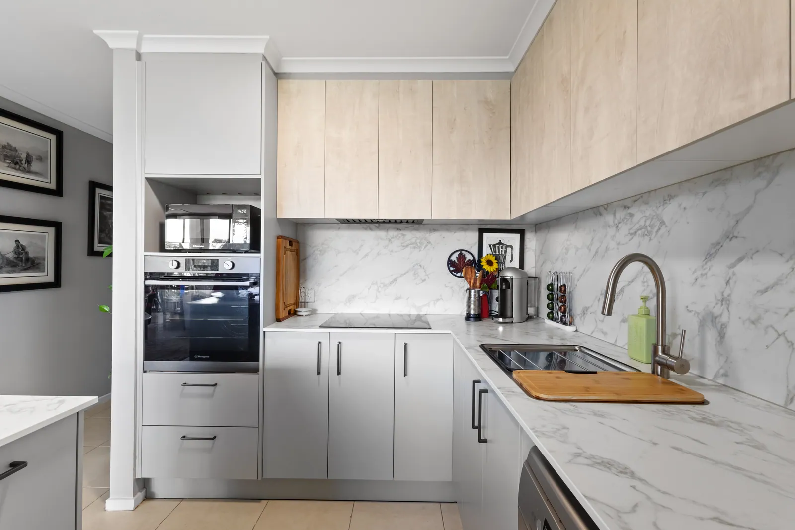 Wall oven, sink and grey cabinetry in the Bruce kitchen