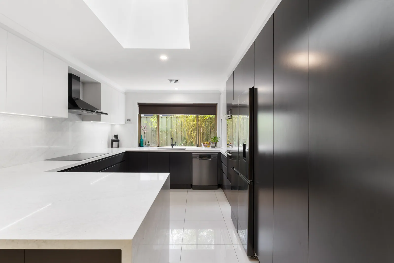 Calwell kitchen bench runs and tall black cabinetry