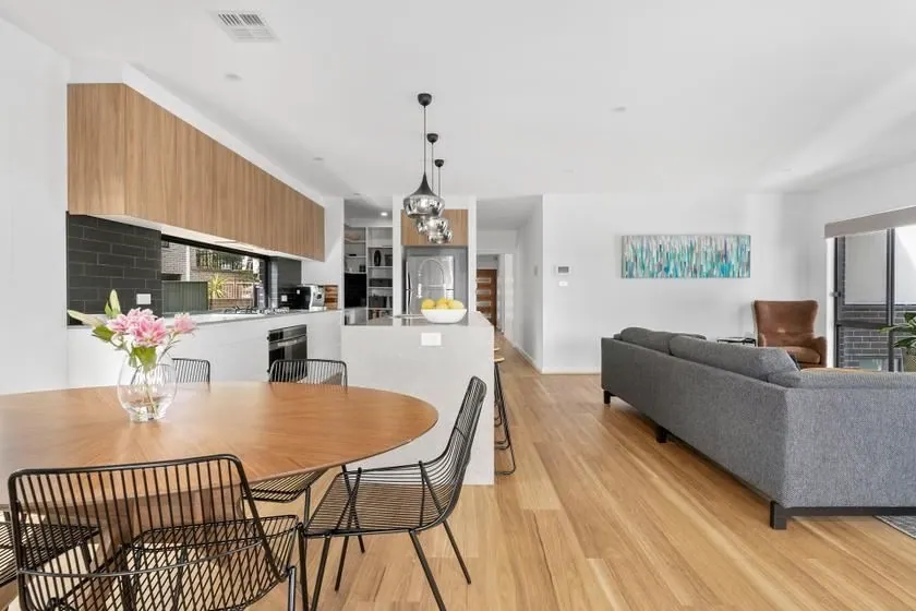 Flynn kitchen and dining area with timber overhead cabinetry