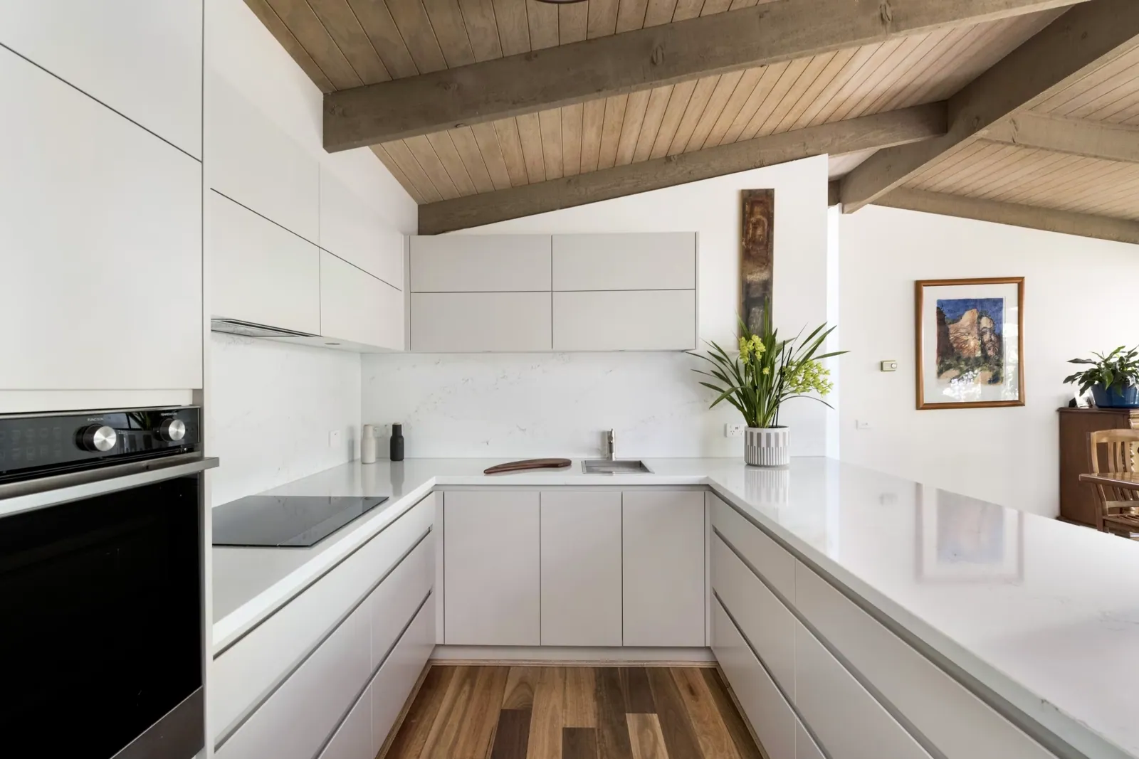 Mawson kitchen with white cabinetry, wall oven and cooktop