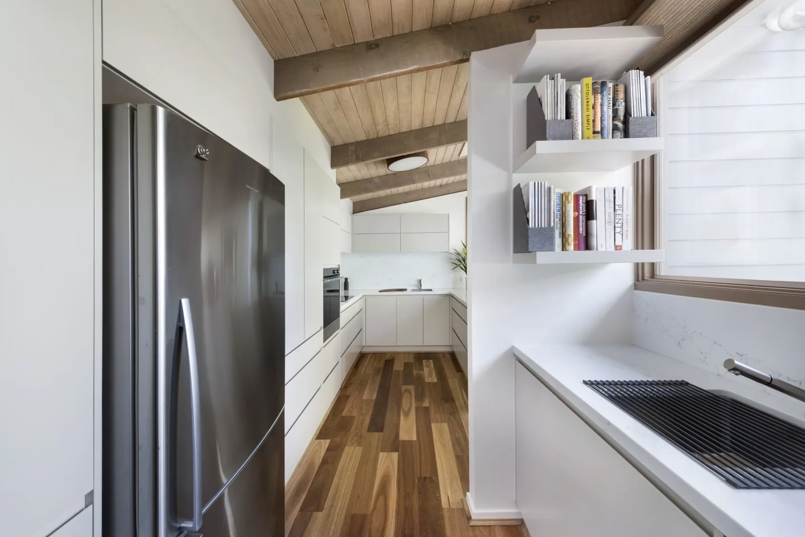 Floating shelves and white cabinetry in the Mawson kitchen