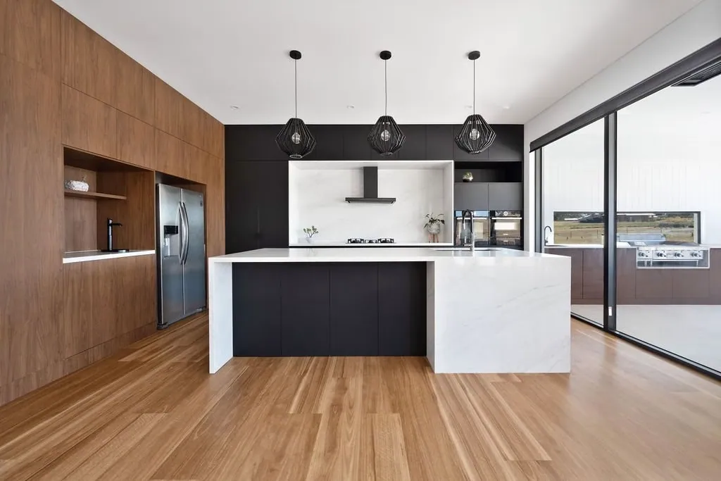 Timber-lined wall beside the black Murrumbateman kitchen joinery