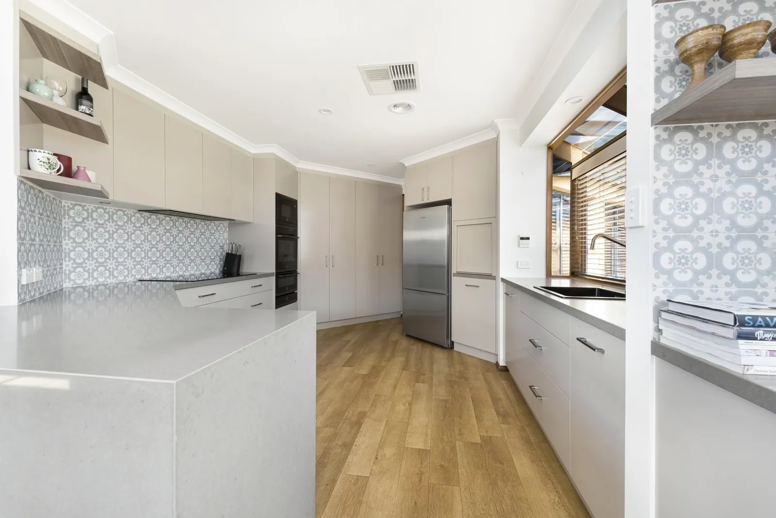 Stone benchtop and bench run in the Nicholls kitchen