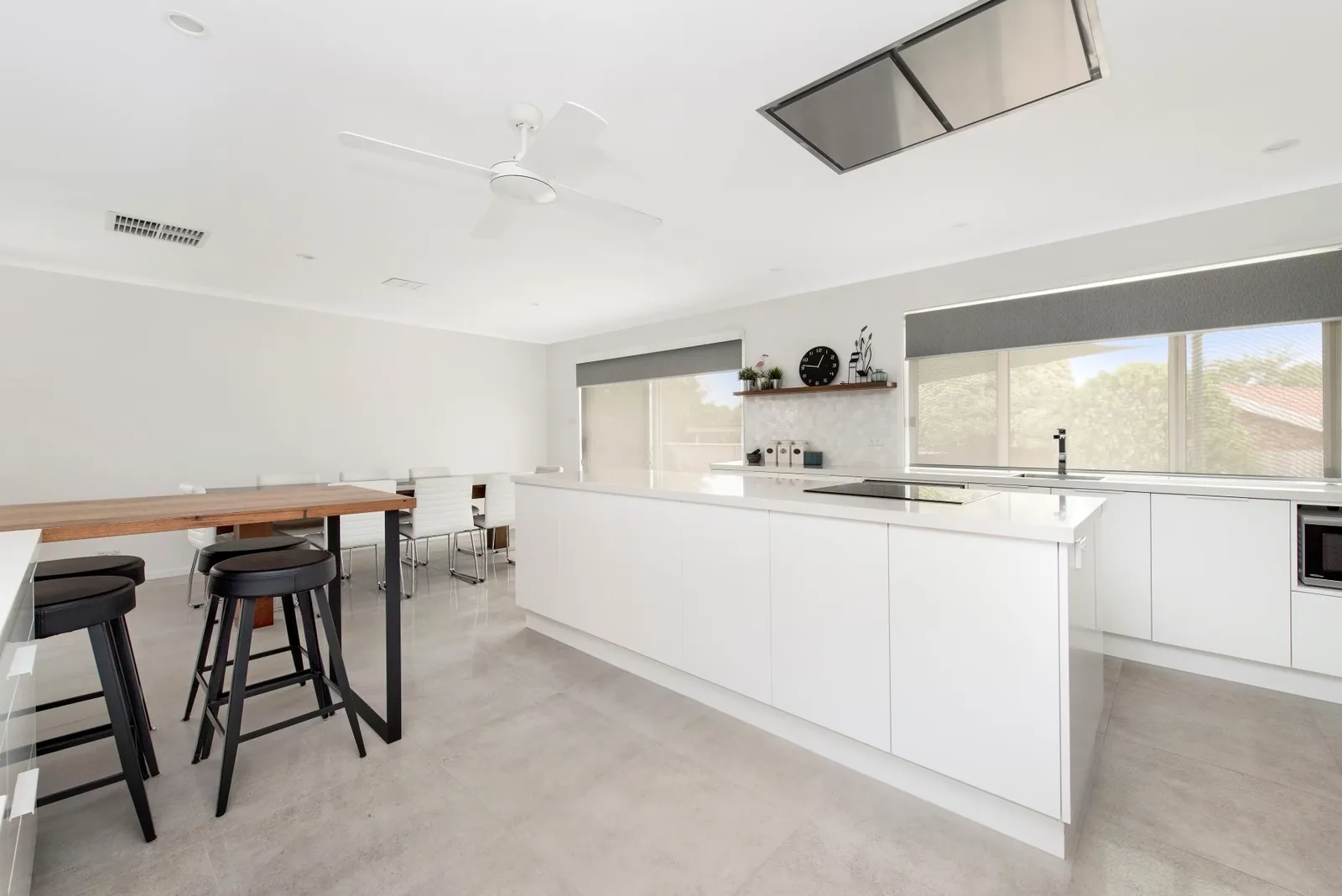 Palmerston kitchen island and dining area with a timber bar top