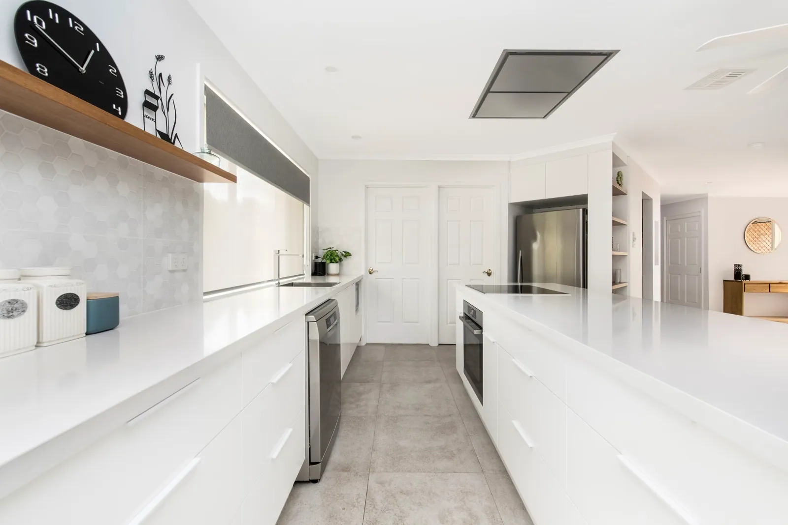 White bench run with a timber shelf and window in the Palmerston kitchen