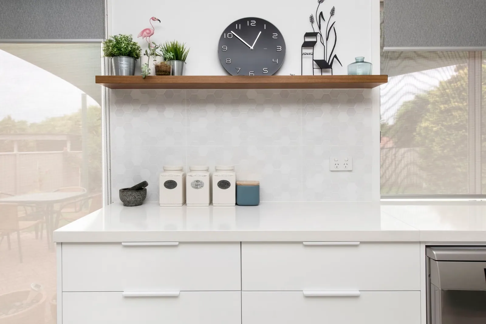 White benchtop and timber shelf detail in the Palmerston kitchen