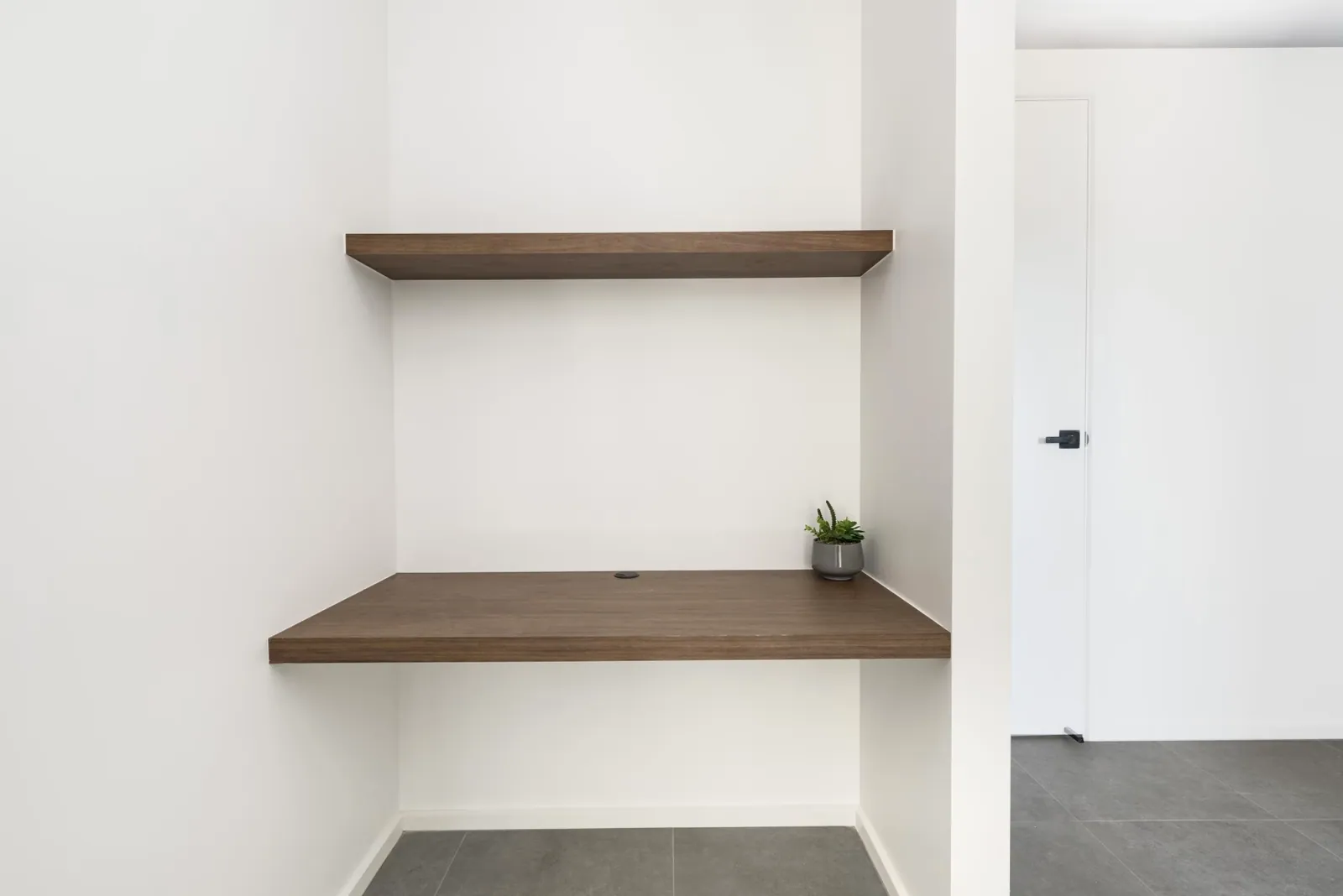 Built-in office nook with timber shelves in the Taylor home