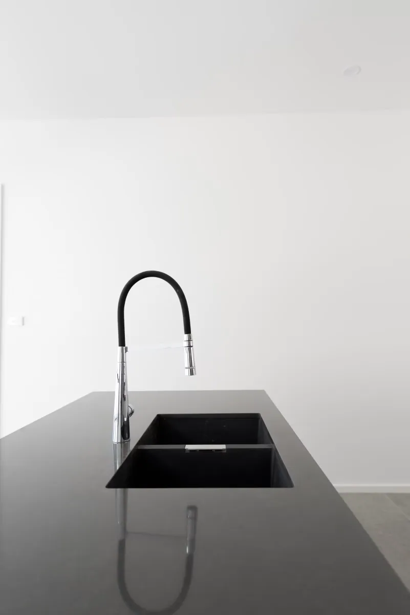Undermount sink and mixer tap in the dark Taylor benchtop